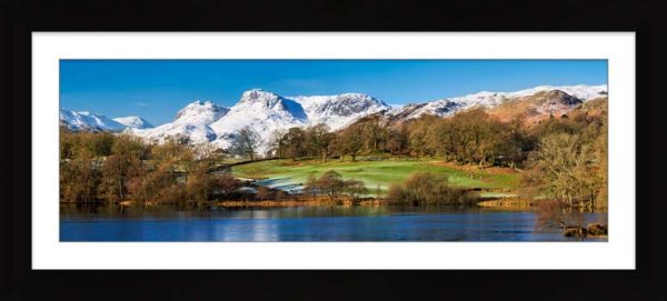 Icy Loughrigg Tarn and Snowy Pikes framed print with Mount
